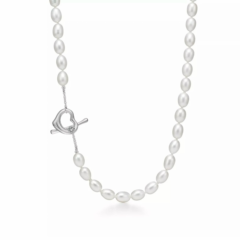 Timeless open heart Tiffany design is 18” long. Must have! Excellent condition.